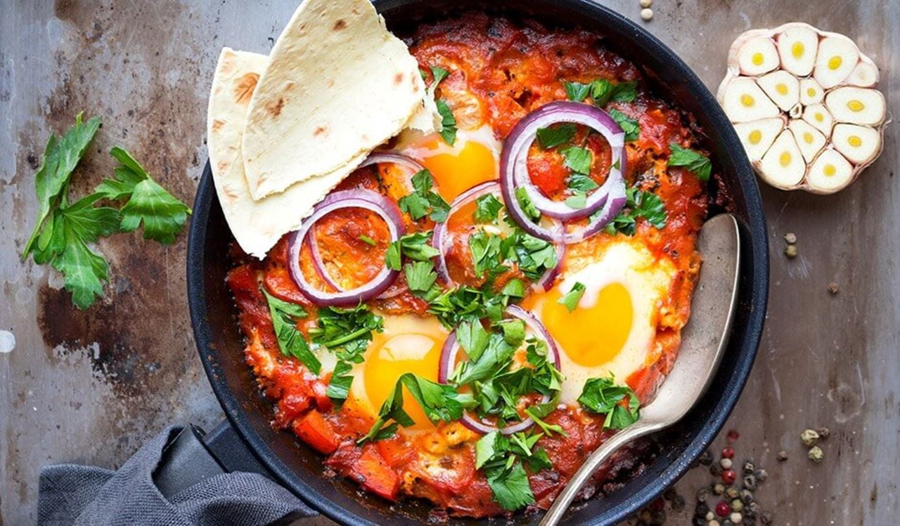 recipe image Oosterse shakshuka met pitabrood